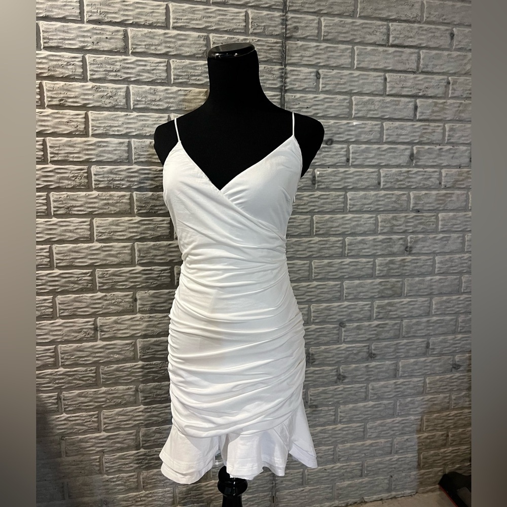Thats So Fetch size 4 white dress with straps, slit in back, and ruffle
